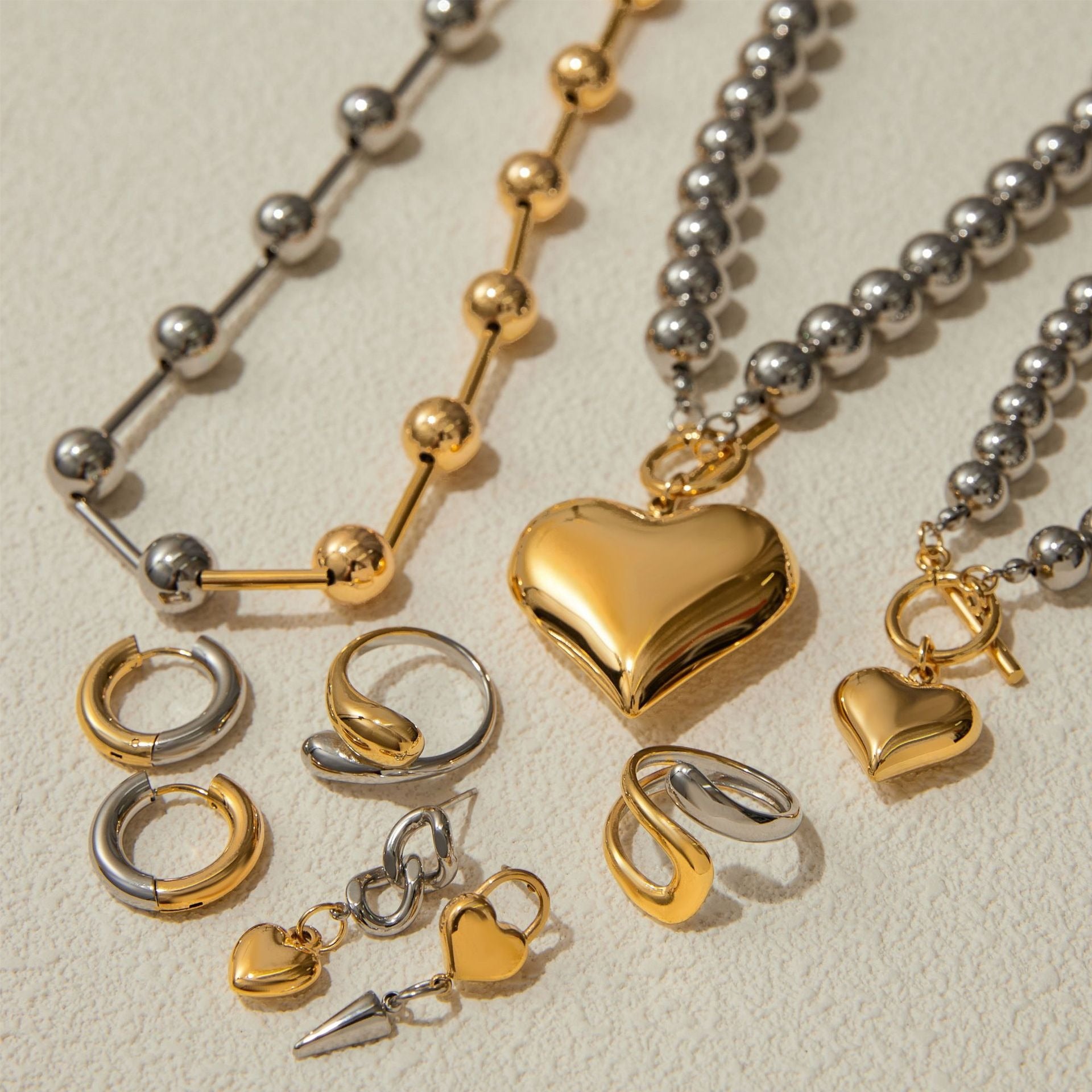 Kaze 18K Gold Heart-Shaped Jewellery Set with Gold and Silver Contrast | Necklace, Bracelet, Ring &amp; Earrings