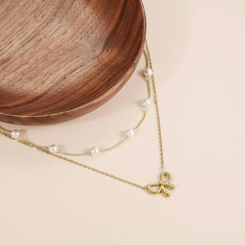 Kaze Minimalist Pearl Bow Necklace | Titanium Steel Pendant Necklace in Gold &amp; Silver